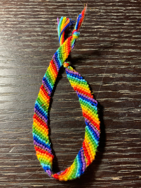 Rainbow color misanga including gold string within.