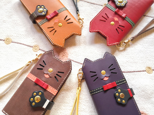 ＊仕舞い忘れのベロ出しにゃんこ＊leather sumyaho case＊猫の手帳型レザースマホケース／全機種